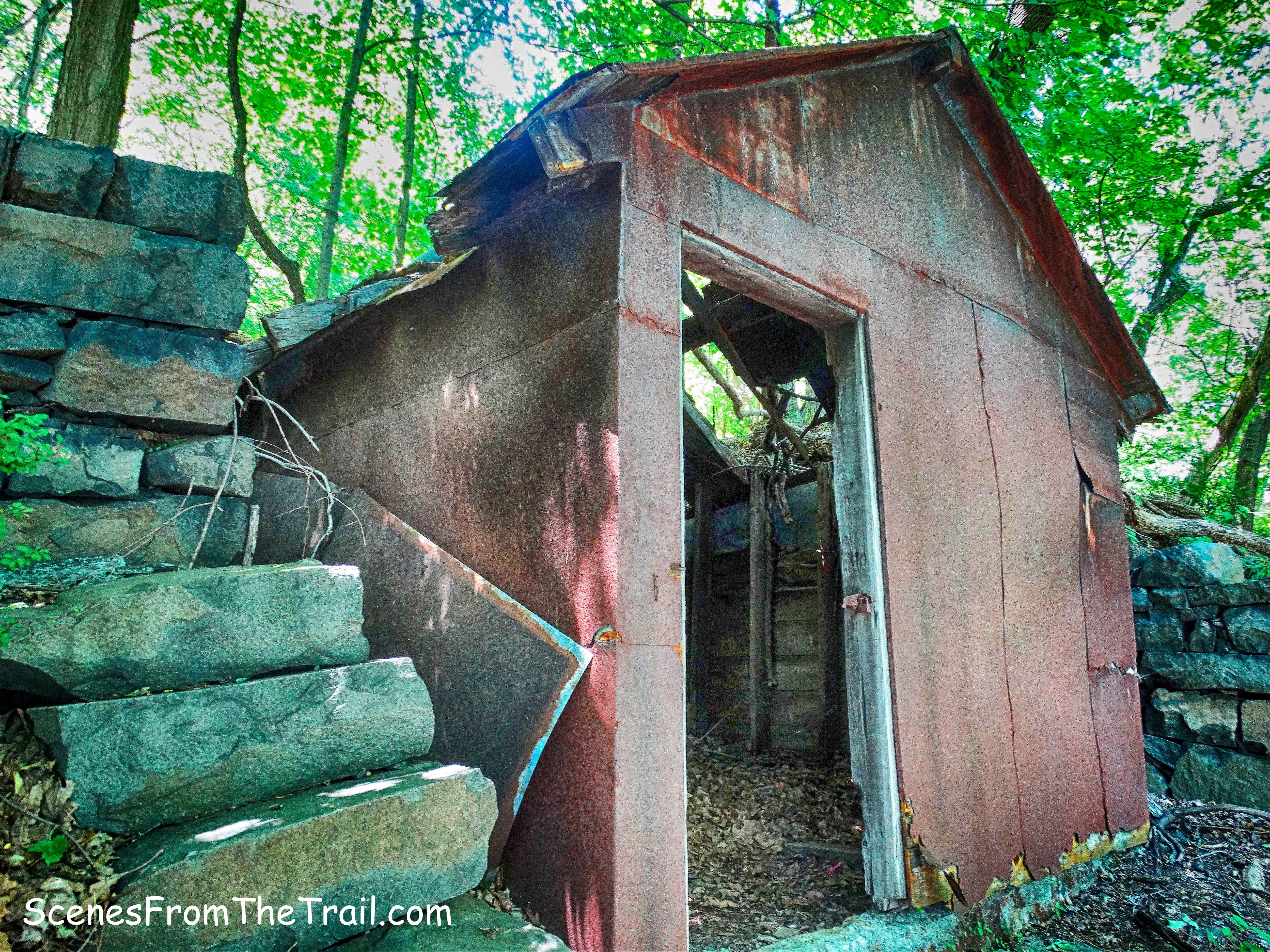 ruined metal shack