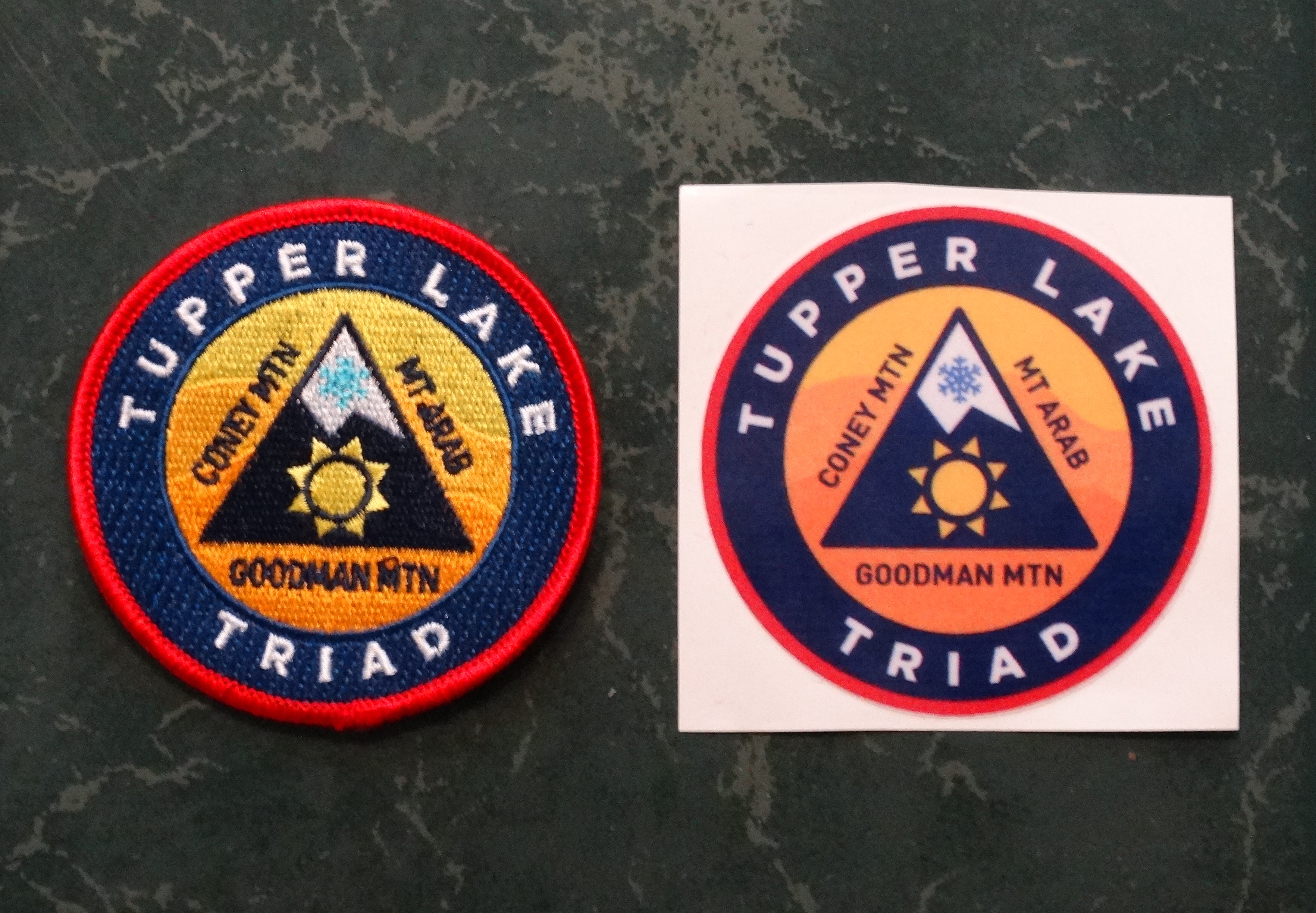 Tupper Lake Triad Challenge patch and window sticker.