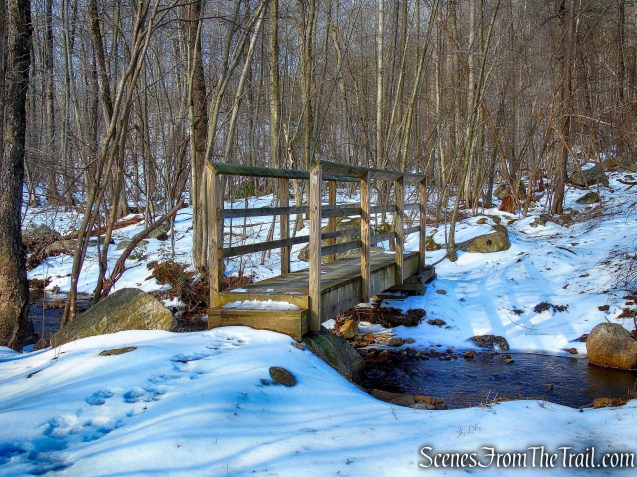 Doris Duke Trail crosses a wooden footbridge