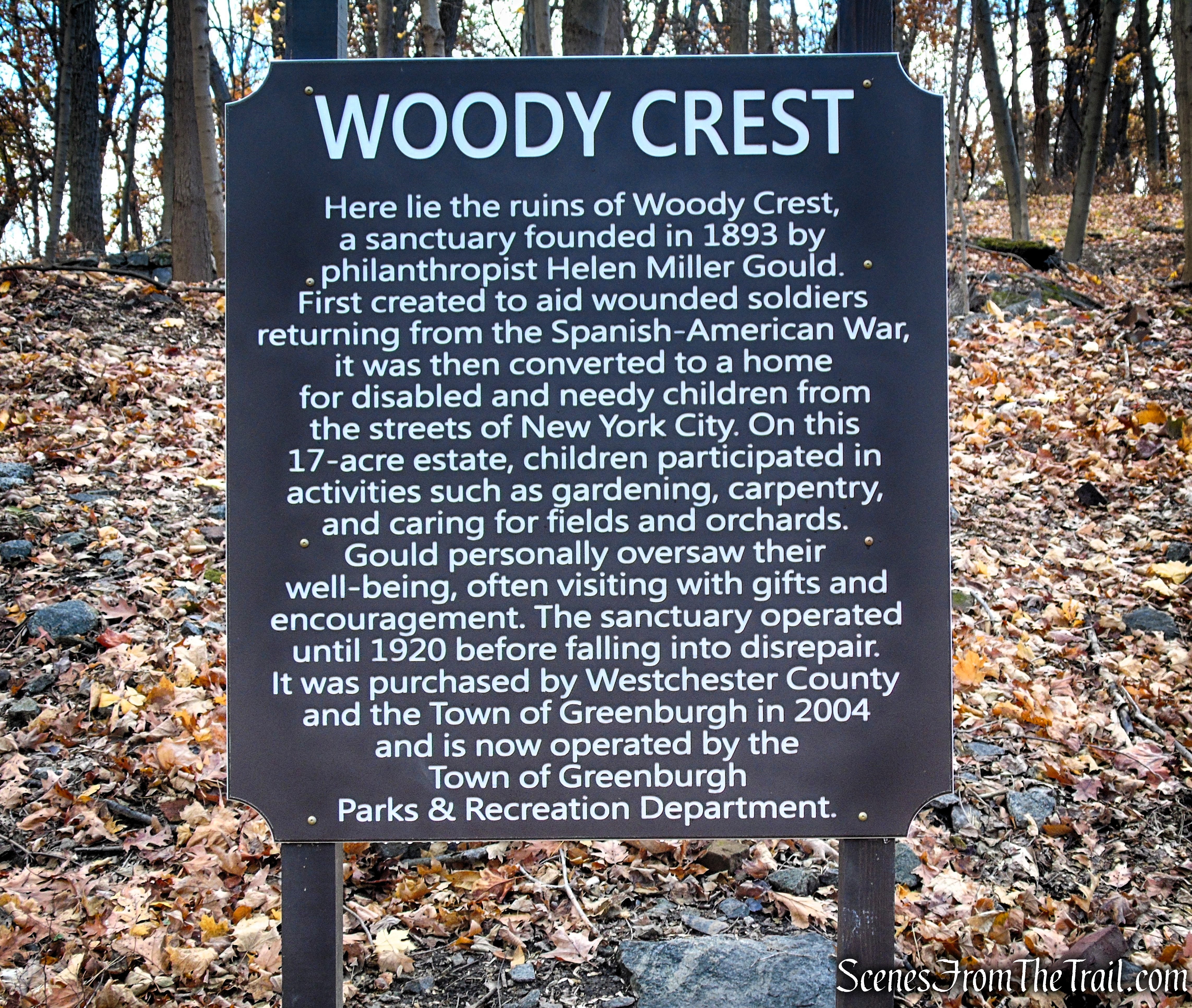Woody Crest sign