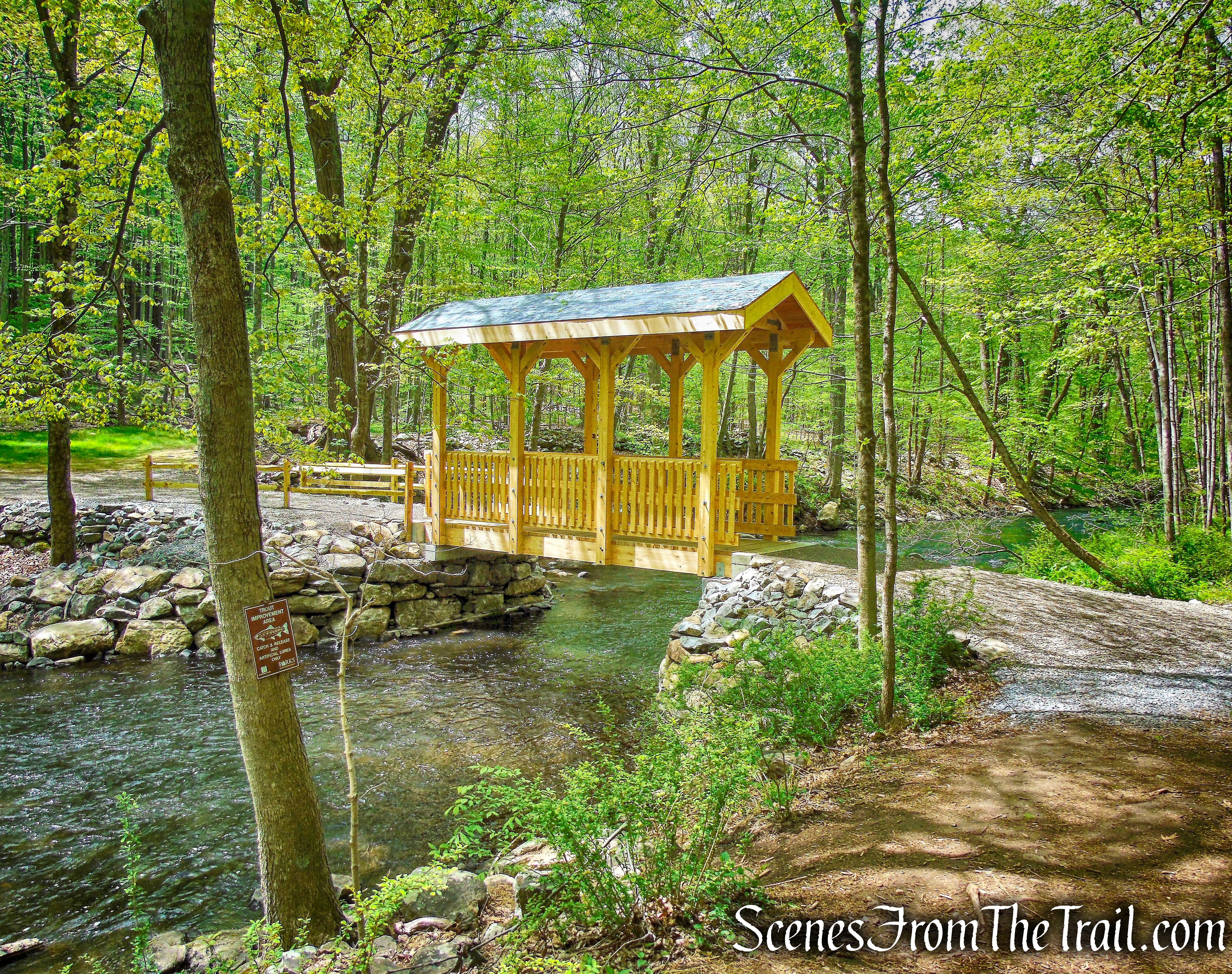 turn left and cross the bridge over the river