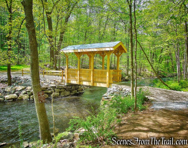 turn left and cross the bridge over the river