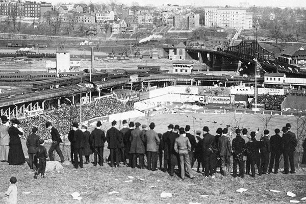 Fans on Coogan's Bluff watch a game between the Giants and Cubs at the Polo Grounds, September 23, 1908